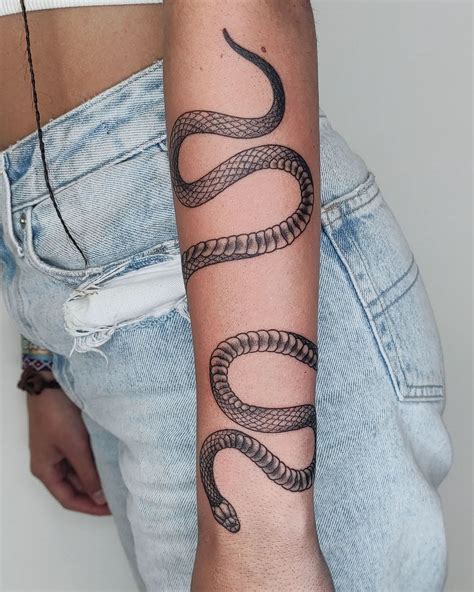 wrap around snake tattoo arm|Snake tattoo wrapped around arm